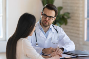 Family Medicine doctor talking to female patient