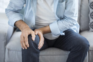 Old man suffering from Arthritis pain