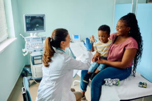 A woman cosulting to doctor in a primary care center